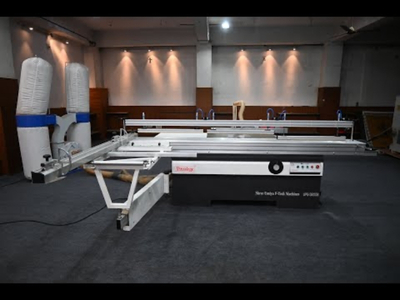Industrial panel saw machine cutting laminated boards at Wudiqa factory