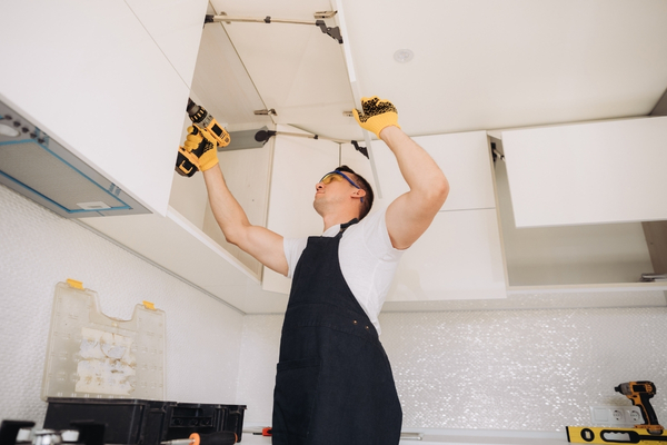 Professional Wudiqa team installing modular kitchen at client site